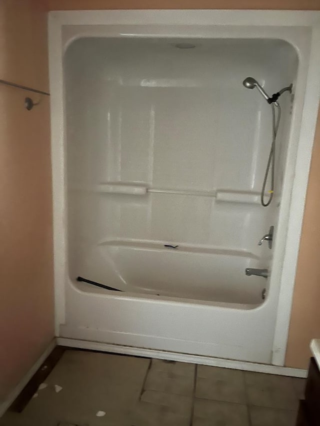 full bath featuring shower / bath combination and tile patterned floors