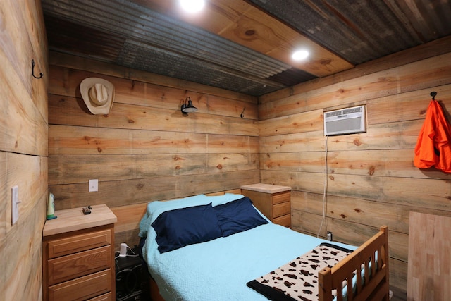 bedroom featuring a wall unit AC, wooden walls, and a sauna
