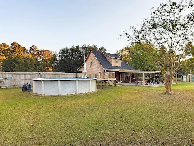 view of yard featuring a pool side deck