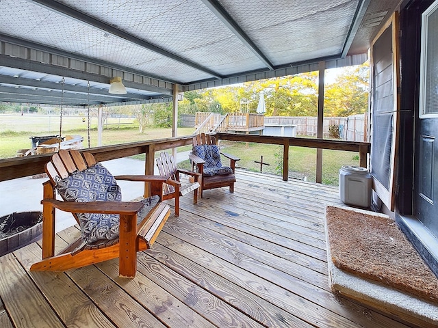 sunroom / solarium featuring plenty of natural light