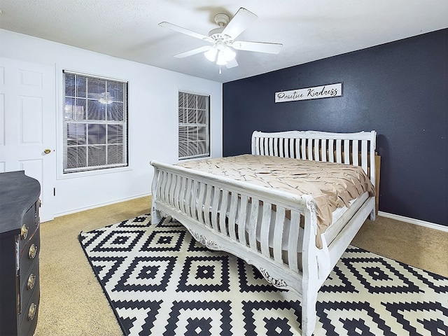 bedroom featuring ceiling fan and a textured ceiling