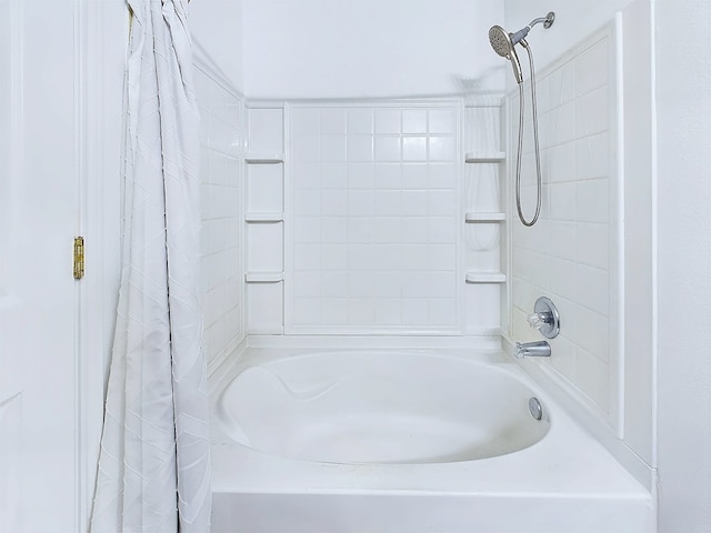 bathroom with shower / tub combo with curtain