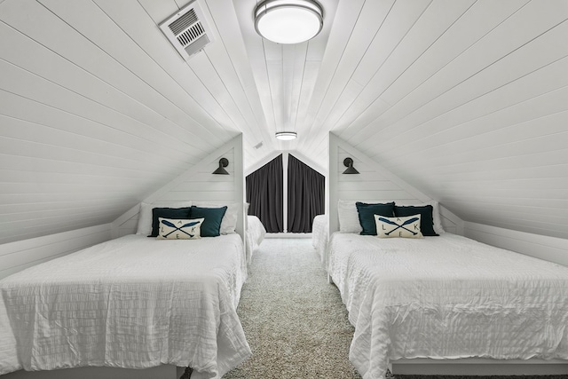 carpeted bedroom with lofted ceiling, visible vents, and wooden walls