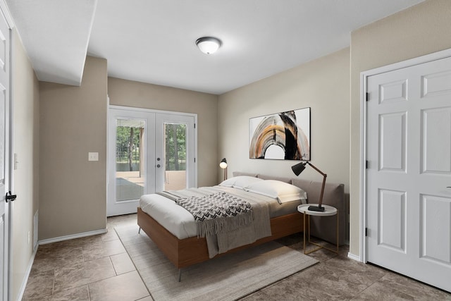 bedroom featuring access to outside, french doors, and baseboards