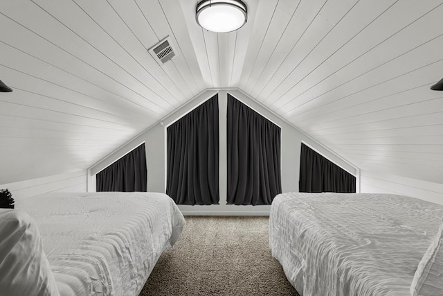 bedroom with lofted ceiling, wood ceiling, visible vents, and carpet floors