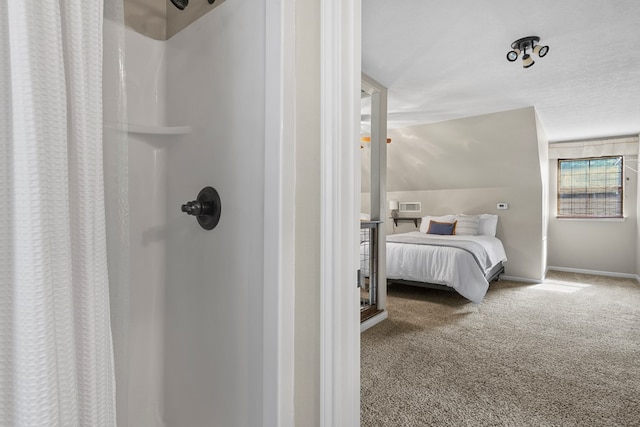 carpeted bedroom with visible vents and baseboards