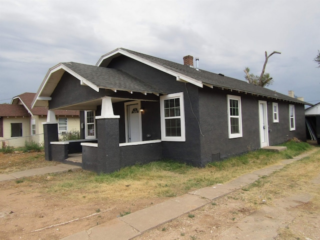 view of property exterior featuring a porch