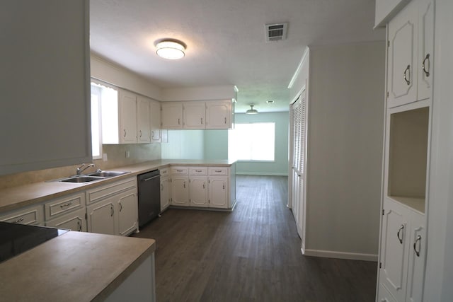 kitchen featuring white cabinets, sink, dark hardwood / wood-style floors, black dishwasher, and kitchen peninsula