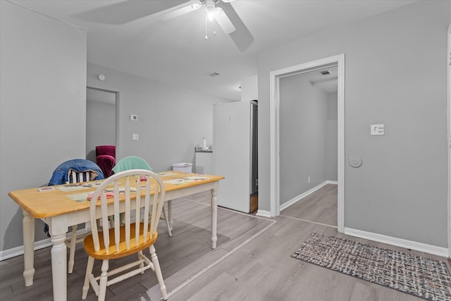 dining space featuring light hardwood / wood-style flooring and ceiling fan