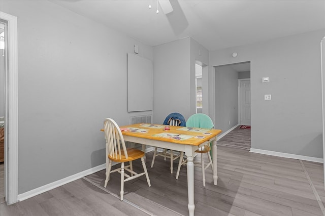 dining room featuring ceiling fan and light hardwood / wood-style floors