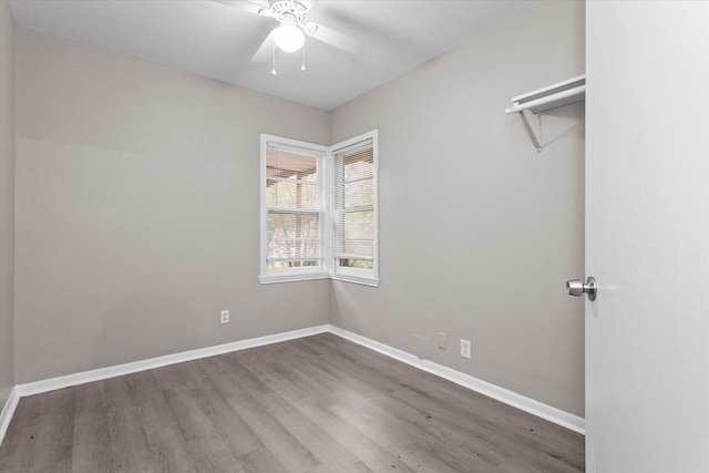 unfurnished room featuring hardwood / wood-style floors and ceiling fan