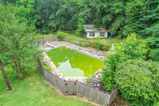 303 W Stringer, Kirbyville, TX 75956 - fenced backyard with a wooded view