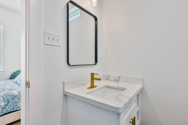 ensuite bathroom with ensuite bath and vanity