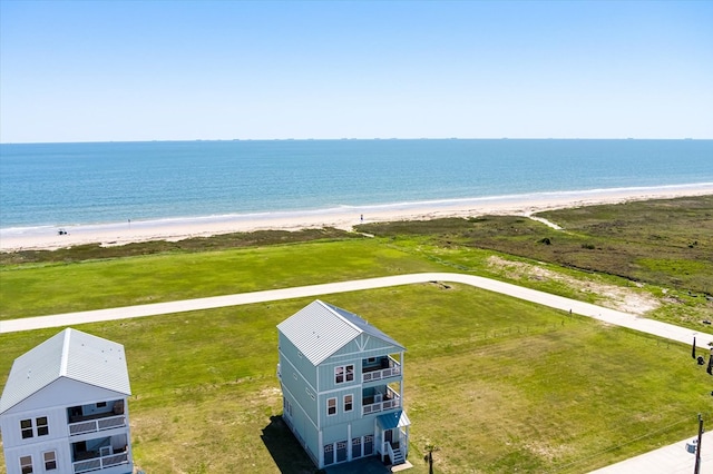 drone / aerial view with a water view and a view of the beach