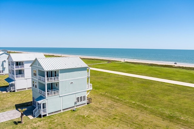 aerial view featuring a water view and a beach view