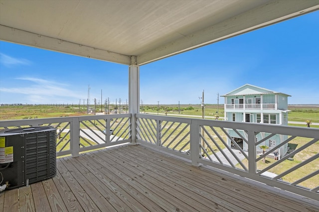 wooden terrace featuring central AC unit