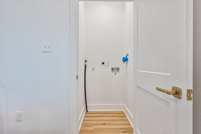 washroom with baseboards, laundry area, hookup for an electric dryer, light wood-style flooring, and hookup for a washing machine