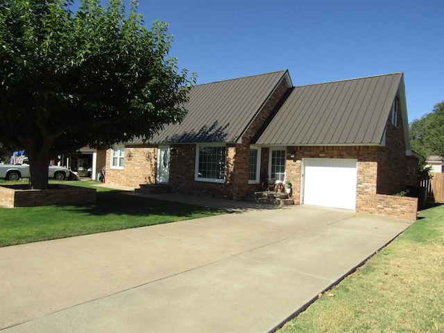 view of front of house with a garage and a front lawn