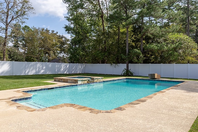 view of pool with an in ground hot tub and a yard