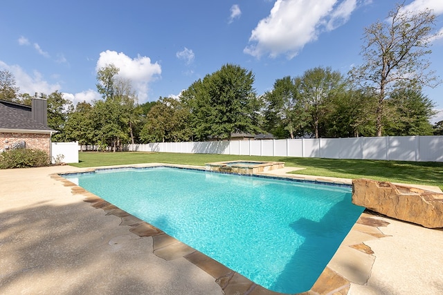 view of pool with a lawn and an in ground hot tub