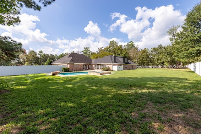 view of yard featuring a fenced in pool