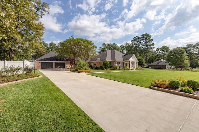 ranch-style home with a front yard and a garage