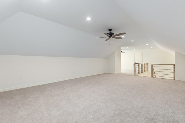 bonus room featuring ceiling fan, light carpet, and lofted ceiling