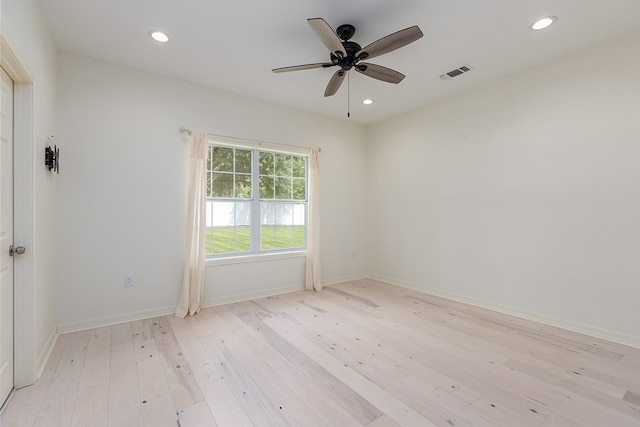 unfurnished room with ceiling fan and light hardwood / wood-style floors