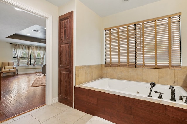 bathroom featuring a bathtub and wood-type flooring