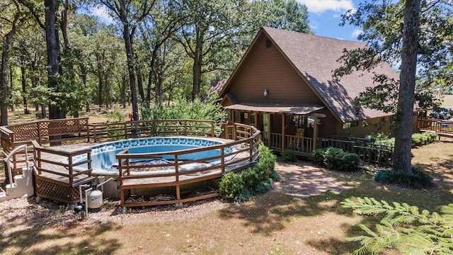 view of pool with a wooden deck