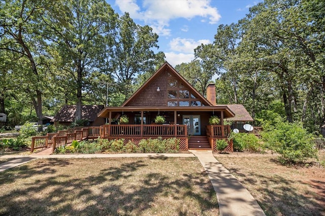 view of front of property featuring french doors and a wooden deck