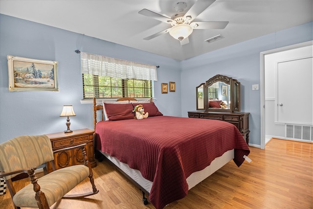 bedroom with light wood-type flooring and ceiling fan