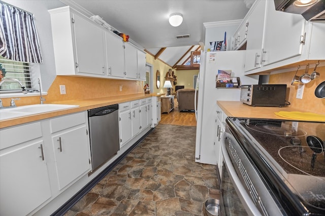 kitchen with dishwasher, lofted ceiling, electric stove, sink, and white cabinetry