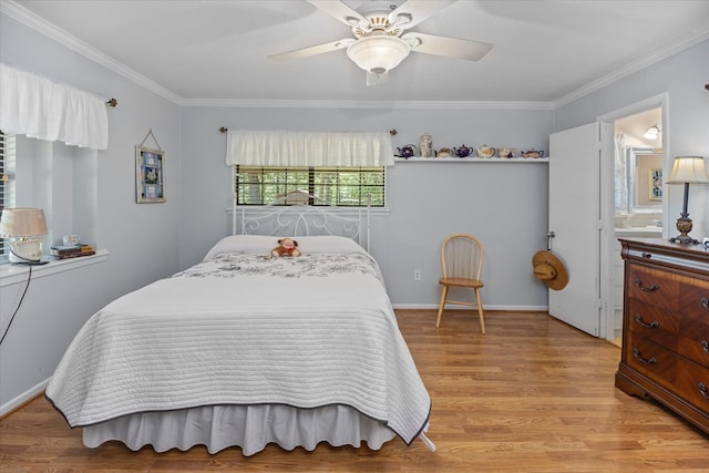 bedroom with ensuite bath, light hardwood / wood-style flooring, ceiling fan, and crown molding