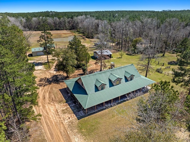 bird's eye view featuring a forest view