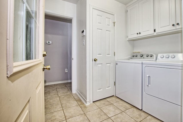 160 Somerset, Milam, TX 75959 - laundry room featuring cabinets, light tile patterned floors, and washer and dryer