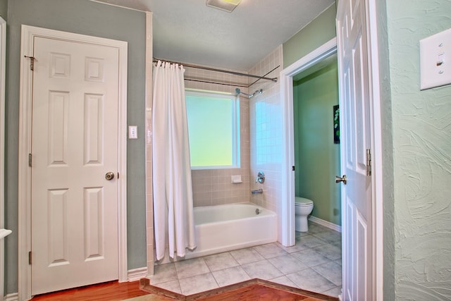 160 Somerset, Milam, TX 75959 - bathroom with tile patterned flooring, toilet, and shower / bath combo with shower curtain