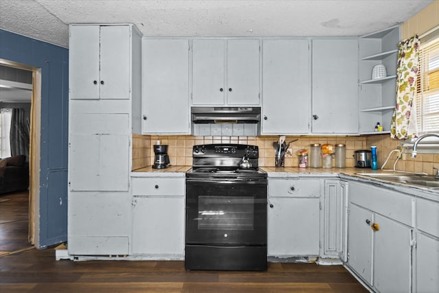 kitchen with dark wood-type flooring, open shelves, under cabinet range hood, a sink, and black electric range oven