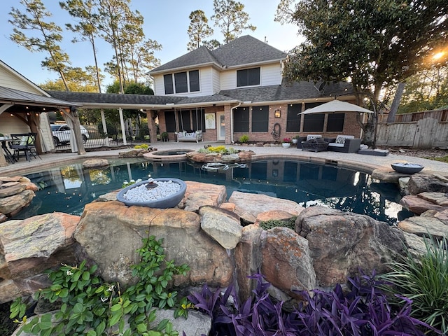 view of pool featuring fence, a patio, an outdoor living space, and a fenced in pool