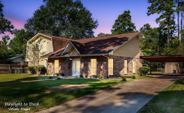 309 Hunters Creek Dr, Lufkin, TX 75901 - view of front of property with driveway, a storage shed, and stone siding
