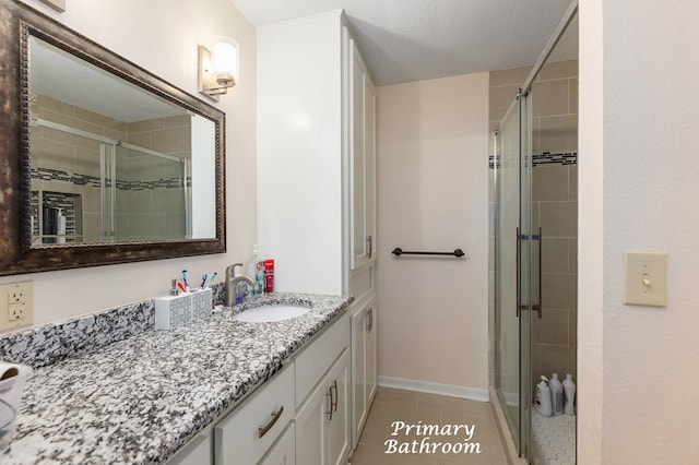 309 Hunters Creek Dr, Lufkin, TX 75901 - bathroom featuring vanity, a stall shower, and tile patterned floors