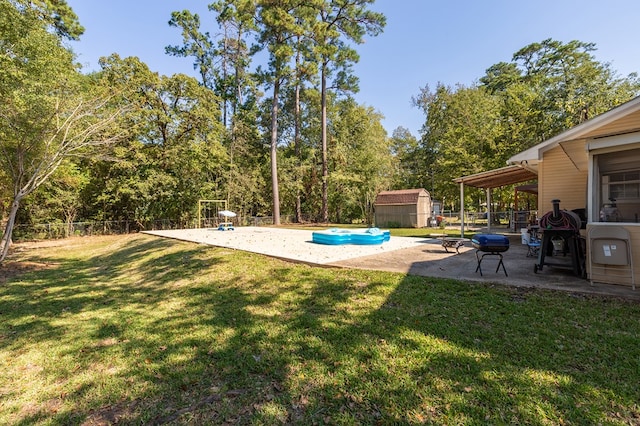 309 Hunters Creek Dr, Lufkin, TX 75901 - fenced backyard featuring a patio area and a storage unit