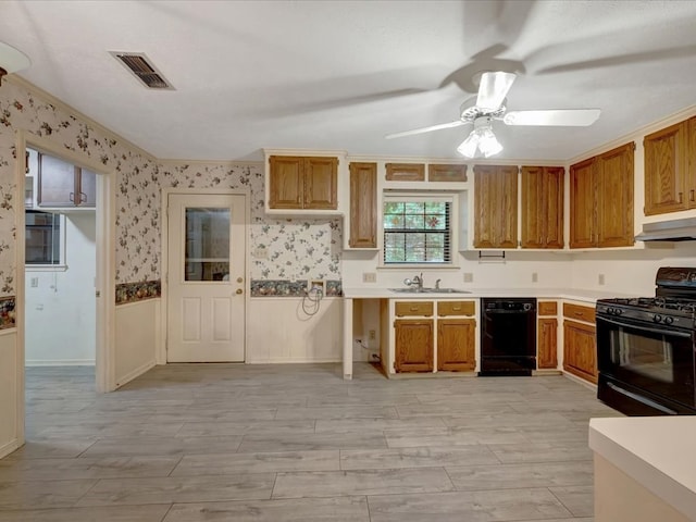 kitchen featuring light wood-type flooring, ornamental molding, ceiling fan, sink, and black appliances