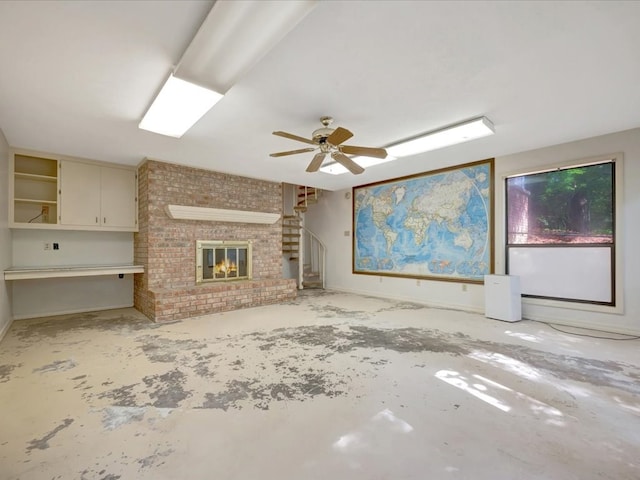 unfurnished living room featuring a fireplace and ceiling fan