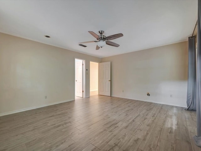 unfurnished room featuring ceiling fan, light hardwood / wood-style flooring, and ornamental molding