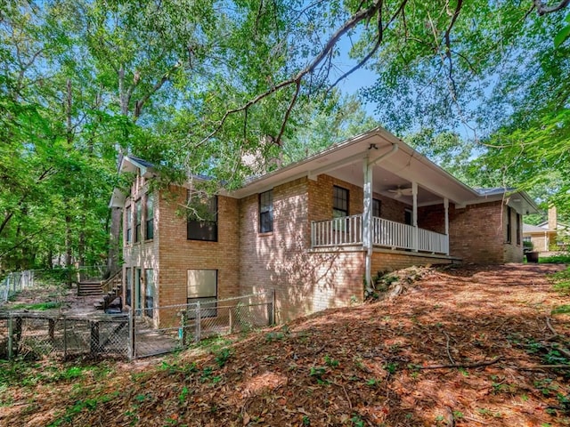 view of side of property with a balcony