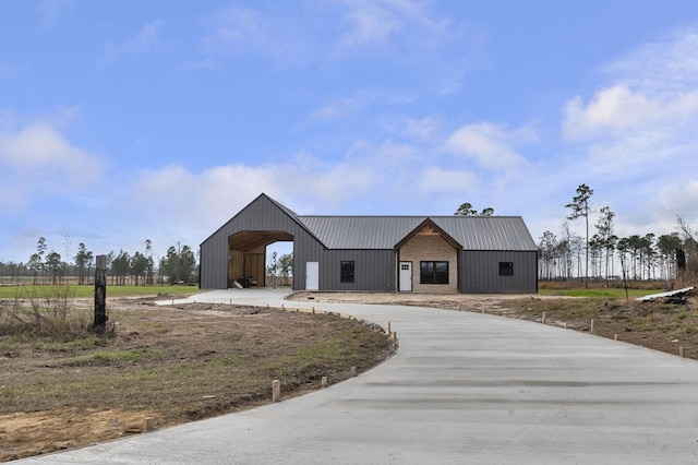 modern inspired farmhouse with an outbuilding