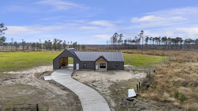 exterior space with an outbuilding and a rural view