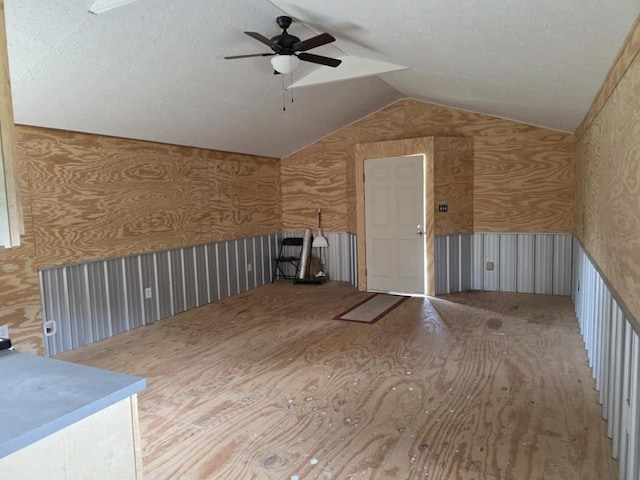 247 Fm 1645, Timpson, TX 75975 - additional living space with lofted ceiling, a ceiling fan, and wallpapered walls