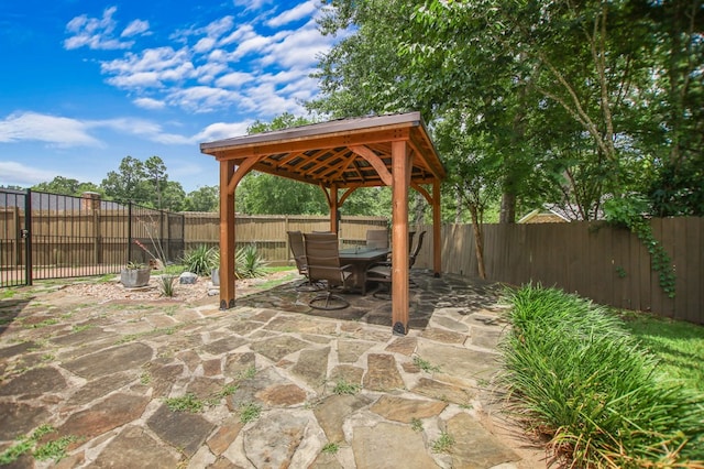 1405 Oak Hill Pl, Lufkin, TX 75904 - fenced backyard featuring outdoor dining area, a gazebo, and a patio